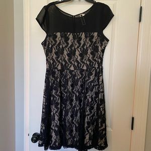 Black cocktail dress with beige lining.